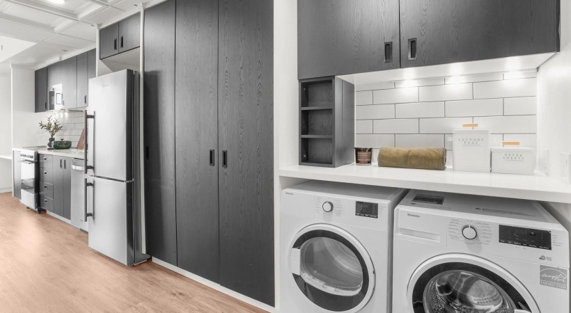 a kitchen with a washer and dryer